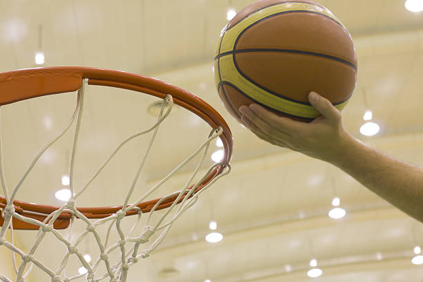 istock scoring basket in basketball court 181745843