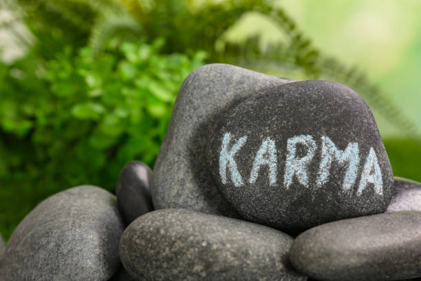 istock Stone with word Karma on blurred background, closeup. Space for text 1817461332