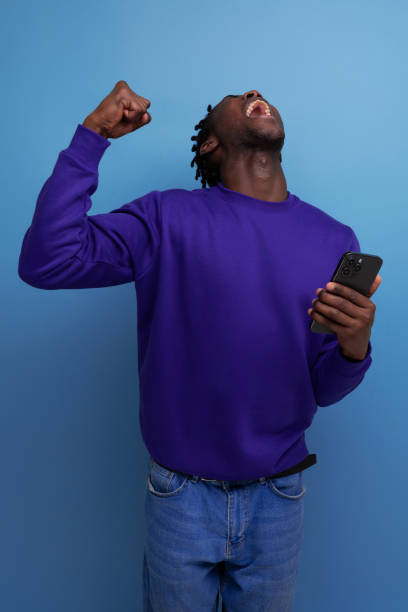 istock lucky winner american young man with dreadlocks in studio background 1817463559