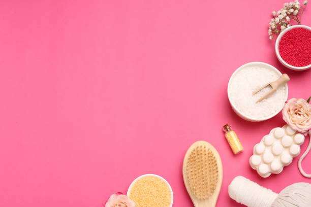 istock Sea salt and different spa products on pink background, flat lay. Space for text 1817474637