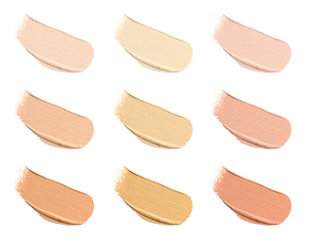 istock Different shades of liquid skin foundation on white background, top view. Set with samples of makeup product 1817475143