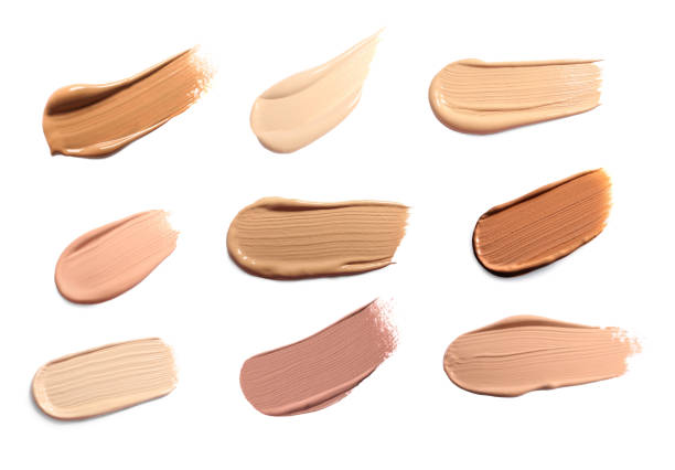 istock Foundation of different textures and shades for various skin types isolated on white. Set with samples of makeup product 1817475693