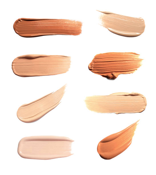istock Foundation of different textures and shades for various skin types isolated on white. Set with samples of makeup product 1817475698
