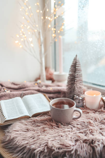 istock Cup of tea and open Bible, winter morning mood 1817485281