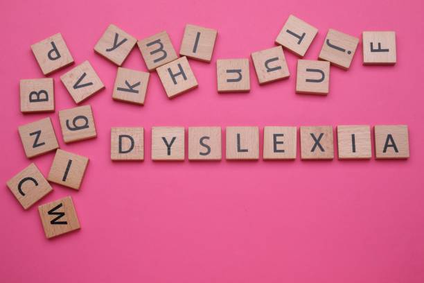istock Wooden cubes with word Dyslexia on pink background, flat lay 1817508579