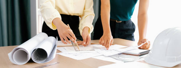 istock Professional architect used divider measure during draft blueprint. Delineation. 1817539343