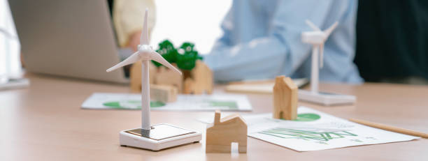 istock Windmill model and wooden block was scatter around on the table. Delineation. 1817544913