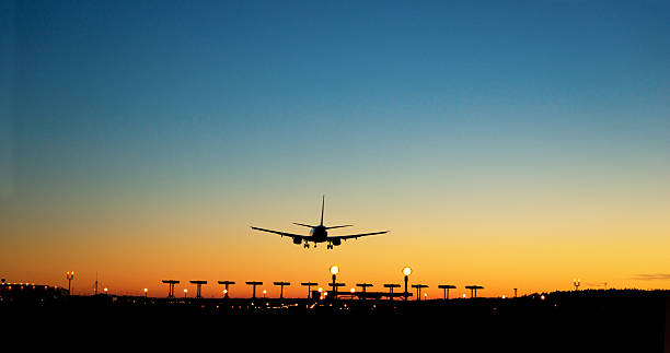 istock aircraft approaching airport at sunset 181754541