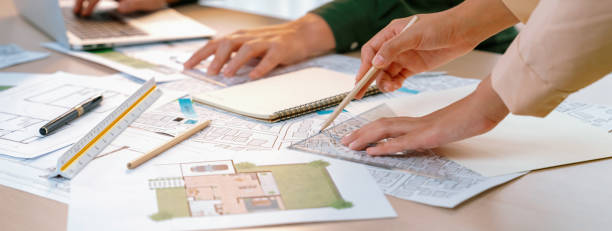 istock Professional engineer team discussion about house design. Closeup. Delineation. 1817564147