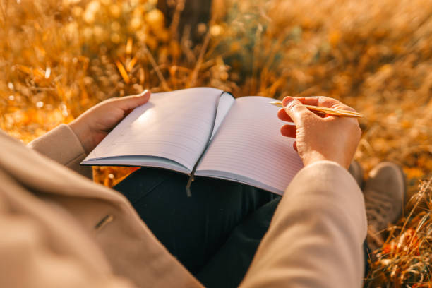 istock Girl with paper planner outdoors, autumn concept 1817572173