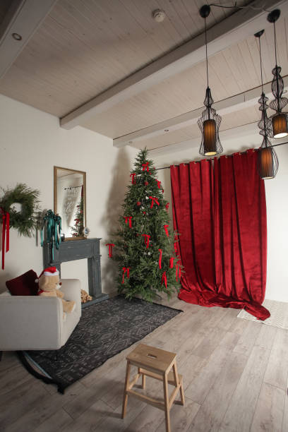 istock Interior modern photo studio with a Christmas tree and gifts 1817573151