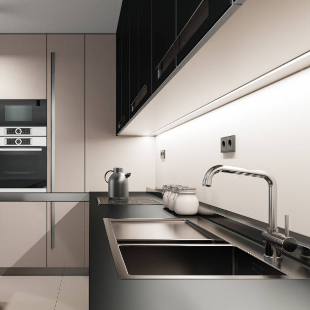 istock Black and Pink Modern minimalist kitchen with long island with stools. Dark materials. 1817580009