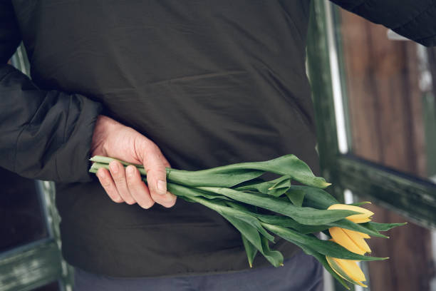istock A man's hand holds flowers. 1817580201
