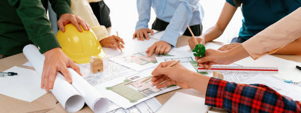 istock Architect team discussing the use of green design in project. Delineation. 1817600130