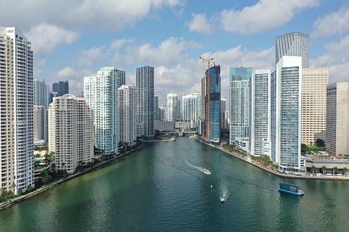 Miami, Florida - April 17, 2021 - Aerial view of entrance to Miami River and surrounding residential and office towers in downtown Miami.