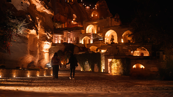 Two female tourists are walking and exploring the city in Cappadocia in Türkiye Turkey.