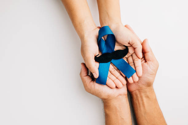 istock Family hands hold a blue ribbon with a mustache 1817756603