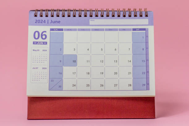 istock Desktop calendar for June 2024 on a pink background. 1817817331