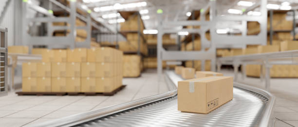 istock Cardboard boxes on conveyor belt in a modern distribution warehouse preparing to ship to customers. 1817818264