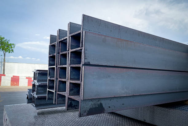 istock Steel beams production. Metal girders stack on project construction , steel h-beam, selective focus, Raw materials used in building construction. 1817836746