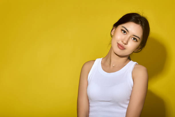 istock foreign student in a white lane poses with a kind expression on her face 1817840037