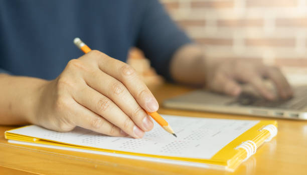 istock close up young man  hand write about booking on calendar to make date for appointment or holiday event for people lifestyle concept 1817840150