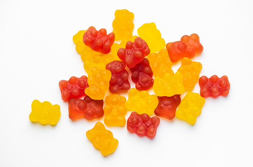 Vitamins for children,   jelly gummy bears candy on white background