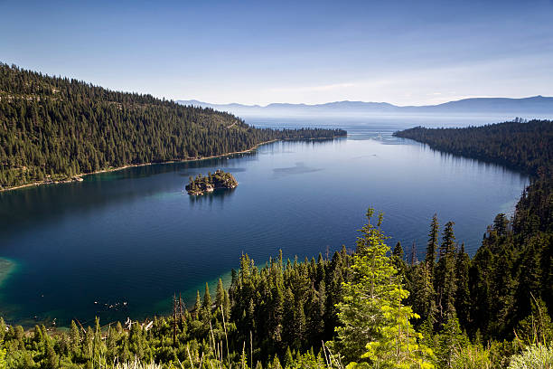 Emerald Bay Lake Tahoe In 1969, Emerald Bay was designated a National Natural Landmark for its brilliant panorama of mountain-building processes and glacier carved granite.  The natural beauty, geology and history of this unique island make it one of the highlights of any visit to the Lake Tahoe area.  The park features Vikingsholm, one of the finest examples of Scandinavian architecture in the western hemisphere and the "Tea House" on Fannette Island, the only island to be found in all of Lake Tahoe.  Emerald Bay was designated an underwater state park in 1994. It is the resting place for many boats, launches and barges used in the lake before the turn of the century, during the heyday of Emerald Bay Resort and used in the construction of Vikingsholm. Mono Lake stock pictures, royalty-free photos & images