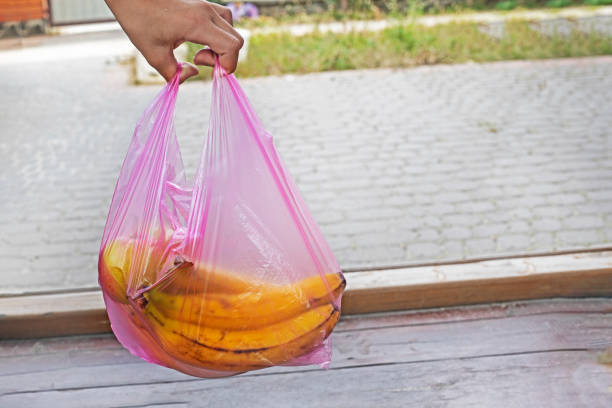 istock keep bananas in a disposable plastic bag. environmental ecologists. shopping in a store 1817864386