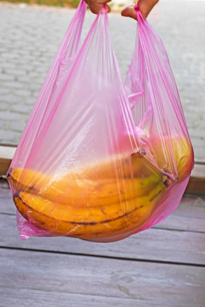 istock keep bananas in a disposable plastic bag. environmental ecologists. shopping in a store 1817864895