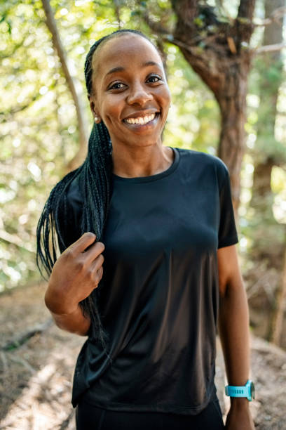 istock Smiling young woman standing outside in a forest on a summer day 1817867478