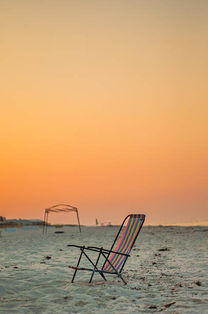 istock Chair on Beach at Sunrise 181787693