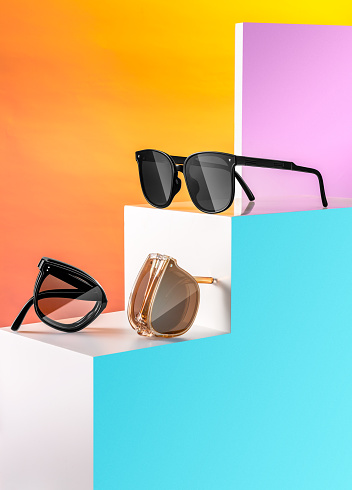 Folding sunglasses, indoor photography light, colorful background, gradient color combination, sunglasses, portable and foldable design concept