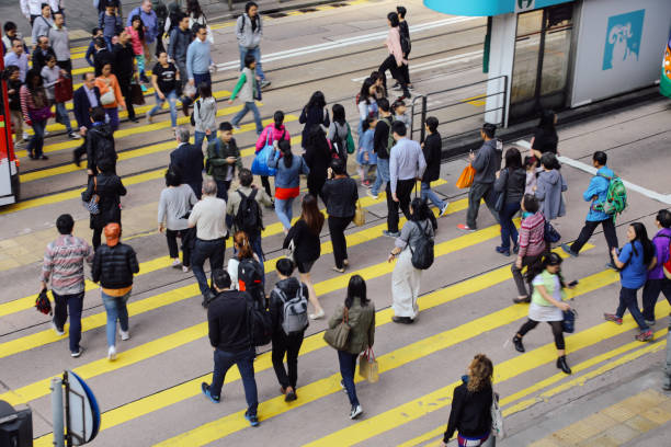 istock Hong Kong downtown rush hour crosswalk crowd commuters crossing 1817890313