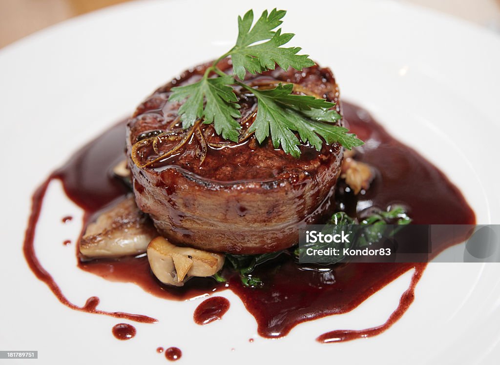 Tenderloin steak wrapped in bacon with red sauce Tenderloin steak wrapped in bacon with demi-glace sauce Tenderloin Stock Photo