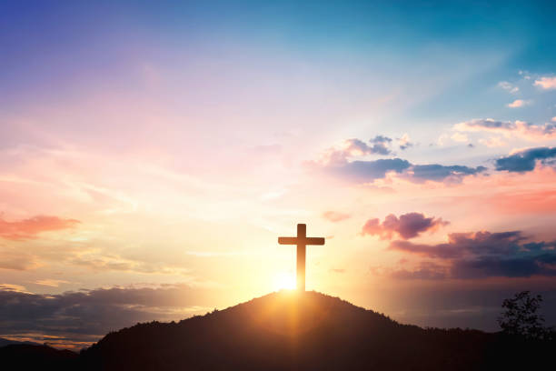 istock Silhouette wooden cross on mountain sunset background 1817907611