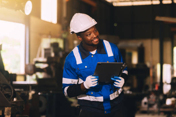 istock Production engineers are assisting adjusting and maintaining factory machine, Male workers technician examining control the industrial technology tool, professional repair men work in industry plant 1817908164