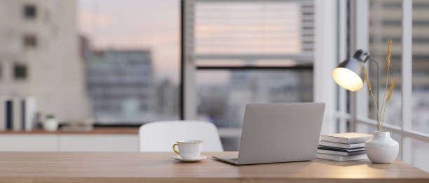 istock Laptop computer on a table in minimal modern living room. Home workspace, closeup image 1817938630
