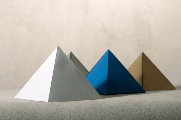 istock Conceptual still life with paper pyramids. 1817954474