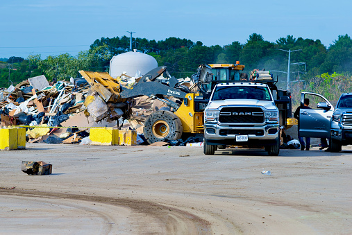 Lorton, Virginia, USA - October 15, 2021: Fairfax County residents unload their waste items at the County’s I-95 Landfill Complex.