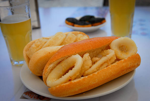 calamari sandwich spanish style sandwich with calamari ( fried squid) calamari photos stock pictures, royalty-free photos & images