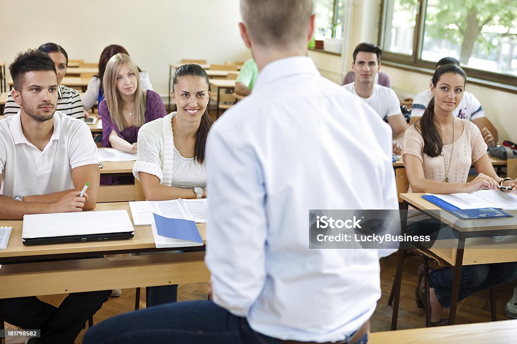 Students on lecturer teacher lecturer  his students in classroom Adult Stock Photo