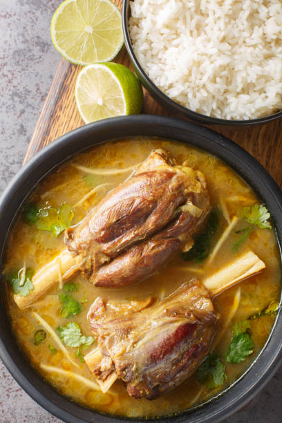 istock Nihari is a deliciously smooth flour based stew with slow cooked mutton and a myriad of spices served with rice closeup. Vertical top view 1818001419