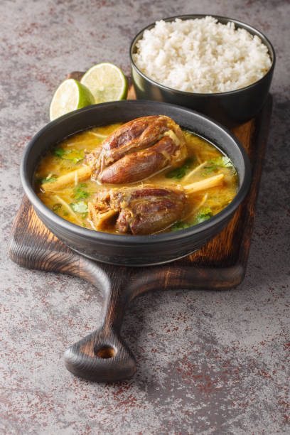 istock Nihari is a deliciously smooth flour based stew with slow cooked mutton and a myriad of spices served with rice closeup. Vertical 1818001951
