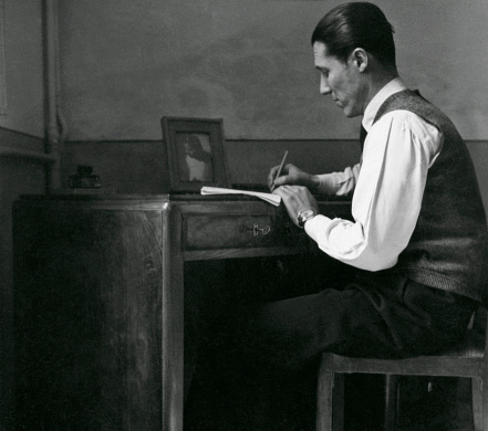 Man Writing at Desk in 1940.