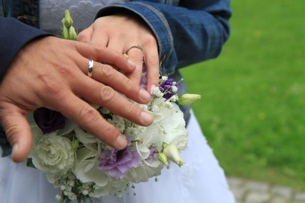 istock wedding rings on the human hands 1818048486