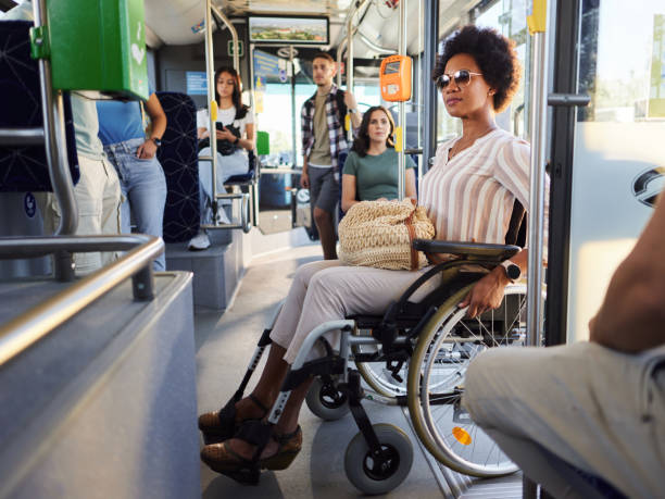 Black disabled woman entering the public transportation.