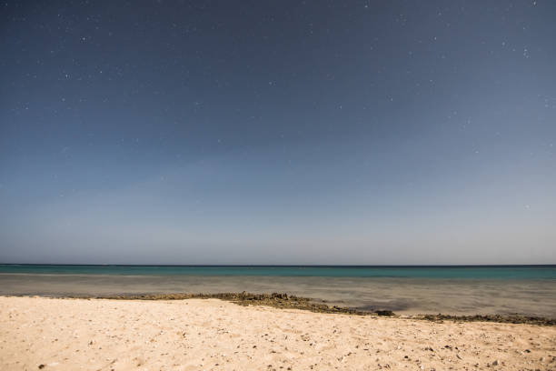 istock clear stairy night with a sandy beach at the red sea 1818055408