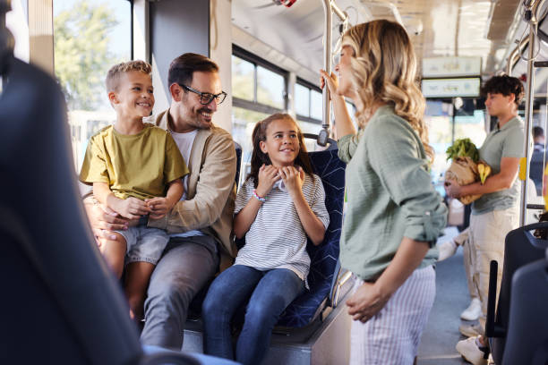 istock Happy family talking while traveling by public transportation. 1818055476