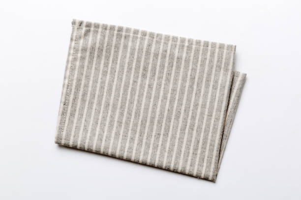istock top view with gray kitchen napkin isolated on table background. Folded cloth for mockup with copy space, Flat lay. Minimal style 1818065012